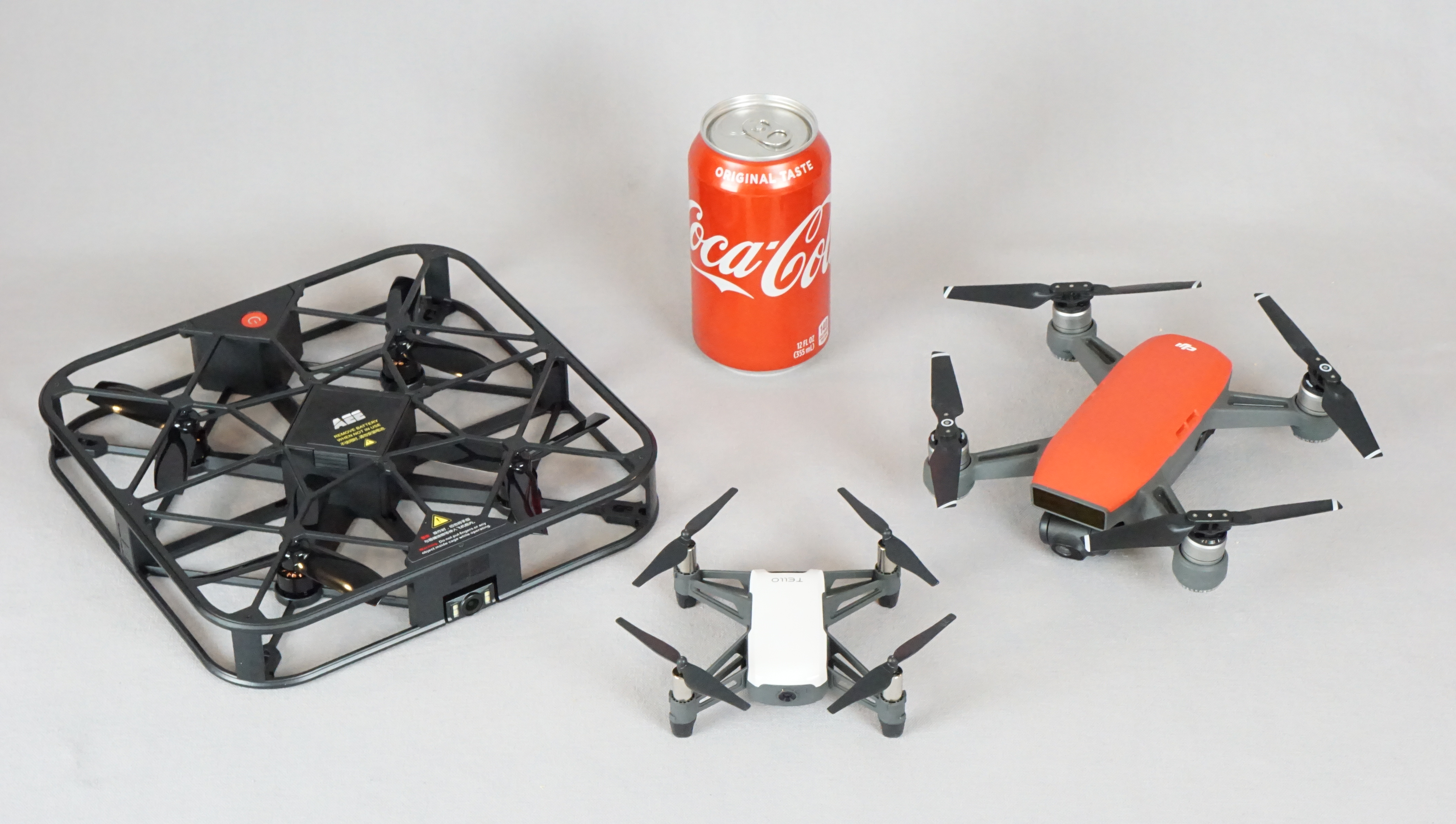 AEE Sparrow with drones and Coke for size comparison